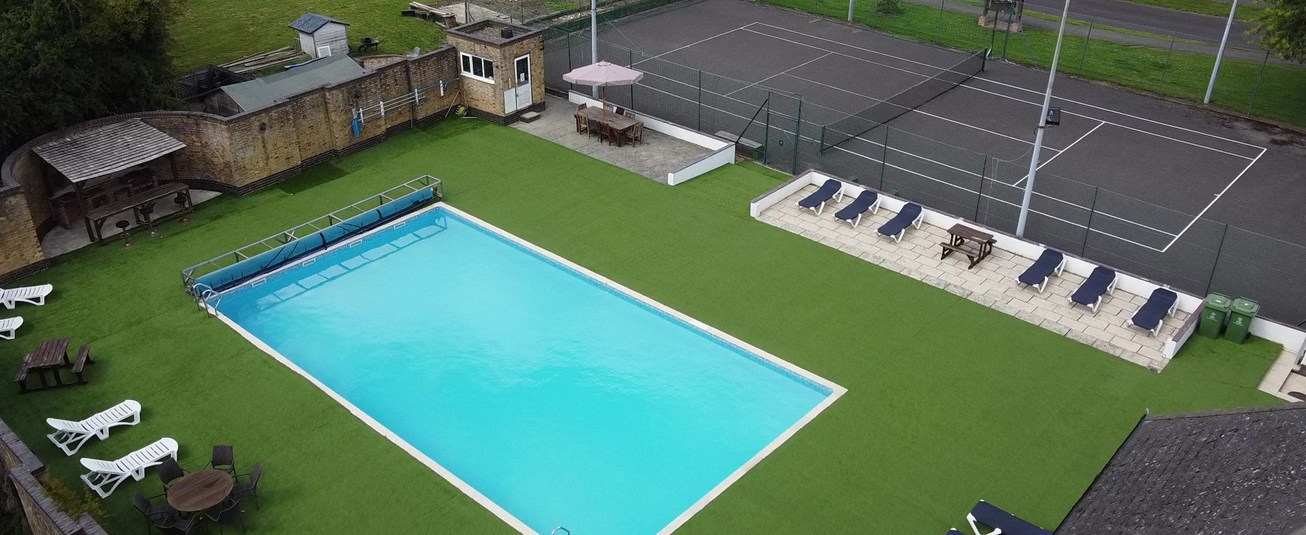 Heated Outdoor Pool, Sun Lounger Deck & Tennis Court • The Bramptons Club (SN5 5SJ)